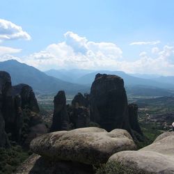 Scenic view of mountains against cloudy sky