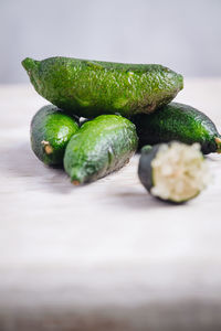 Close-up of green fruits on table