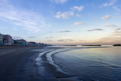 Scenic view of sea against sky at sunset