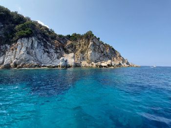 Scenic view of sea against clear blue sky
