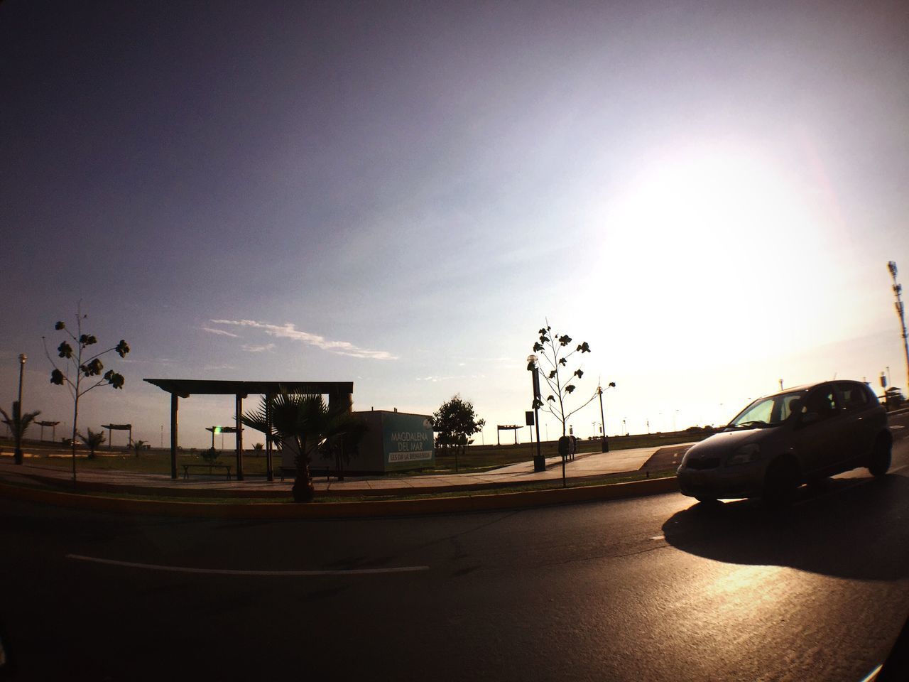 car, transportation, sky, land vehicle, sunset, no people, outdoors, tree, day