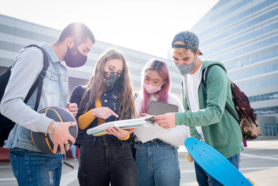 Group of people standing against the wall