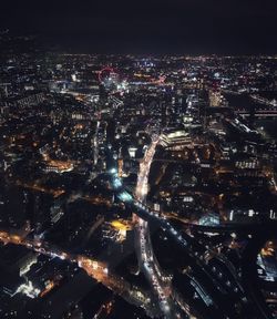 Aerial view of illuminated city at night