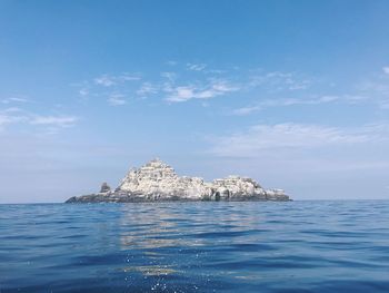 Panoramic view of sea against blue sky