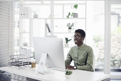 Young man working on table