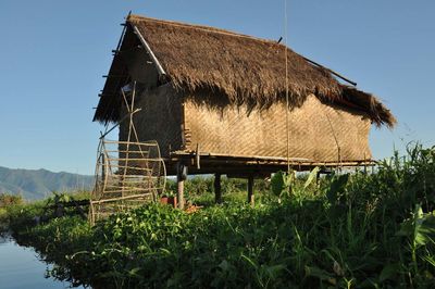 Built structure on field against clear sky