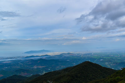 Scenic view of landscape against cloudy sky