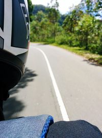 Cropped image of people walking on road