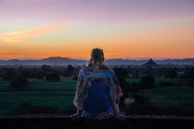 Girl watching sunset at bagan, myanmar