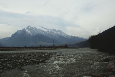 Scenic view of mountains against sky during winter