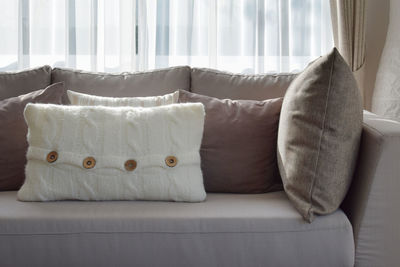 Close-up of sofa on bed at home