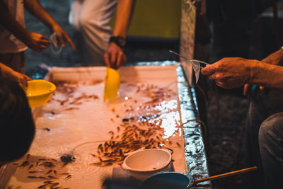 Midsection of man preparing food