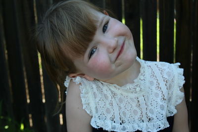 Close-up portrait of smiling cute girl