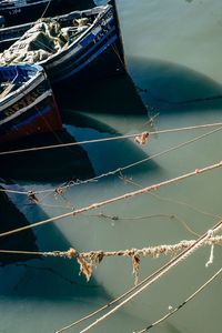 Low angle view of boat moored in water