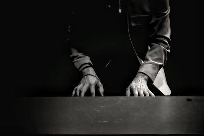 Close-up of man playing piano 