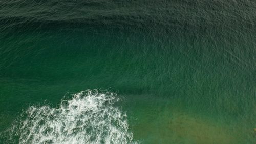 High angle view of water splashing in sea