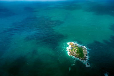 High angle view of blue sea with an island 