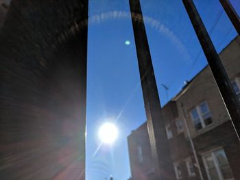 Low angle view of illuminated building against blue sky