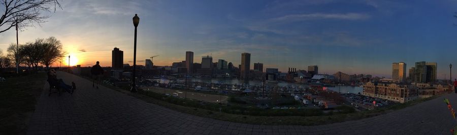 Panoramic view of city against sky during sunset