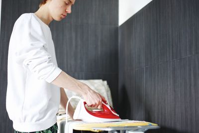 Side view of man working at home