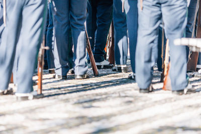 Low section of military people standing on floor