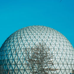 Low angle view of built structure against blue sky