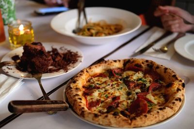 Close-up of pizza served on table