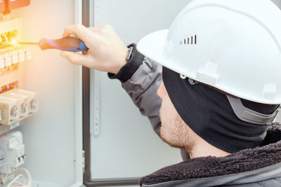 Rear view of man working in workshop