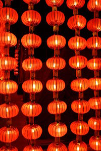 Full frame shot of illuminated lanterns hanging at night