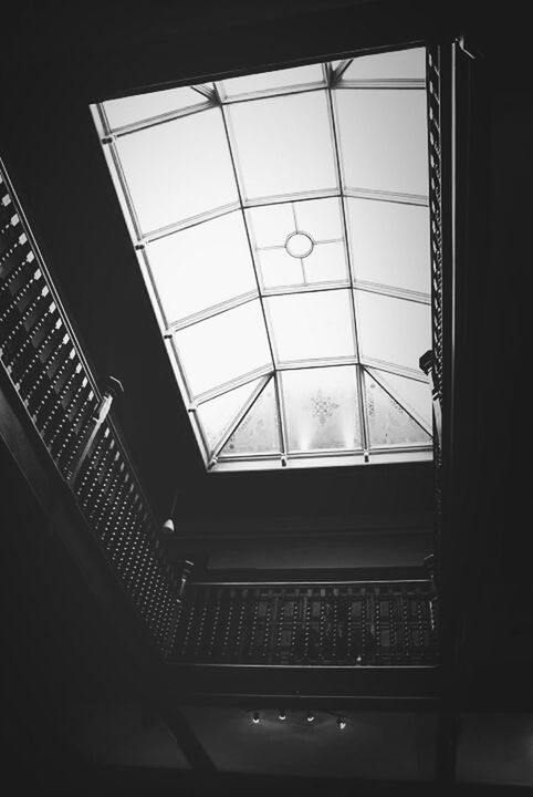 indoors, glass - material, window, ceiling, transparent, architecture, built structure, low angle view, skylight, glass, modern, interior, building, no people, geometric shape, day, pattern, reflection, architectural feature, directly below