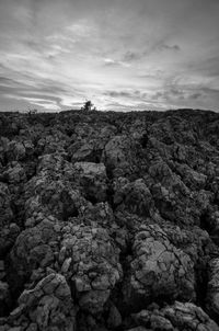 Rock formations on landscape against sky