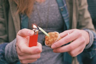 Cropped image of person holding ice cream