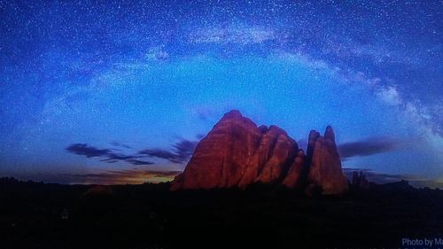 Low angle view of mountain against sky at night