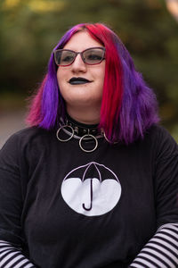 Portrait of young woman with glasses