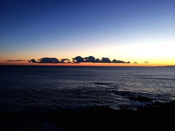 Scenic view of sea against clear sky during sunset