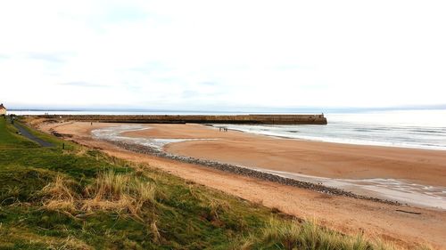 Scenic view of beach against sky