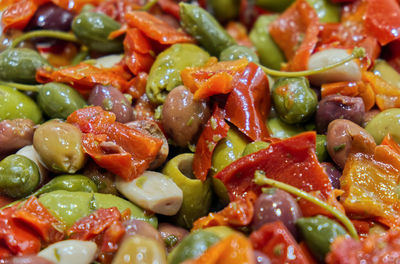 A typical side dish of the italian tradition, the apulian crushed seasoned olives