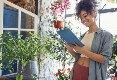 Young woman using digital tablet