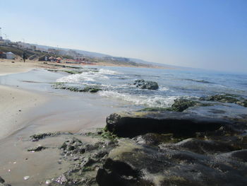 Scenic view of beach against clear sky