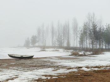 Scenic view of lake against sky during winter