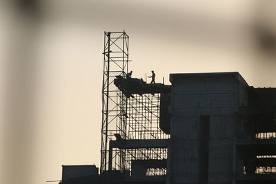 Low angle view of crane at construction site