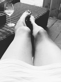 Low section of woman sitting at home