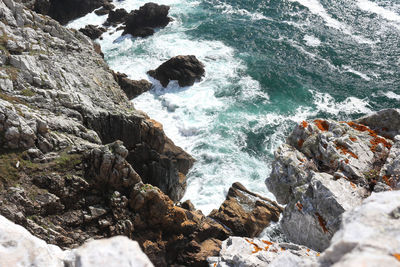 High angle view of rocks in sea