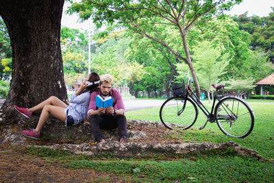 Couple relaxing in park