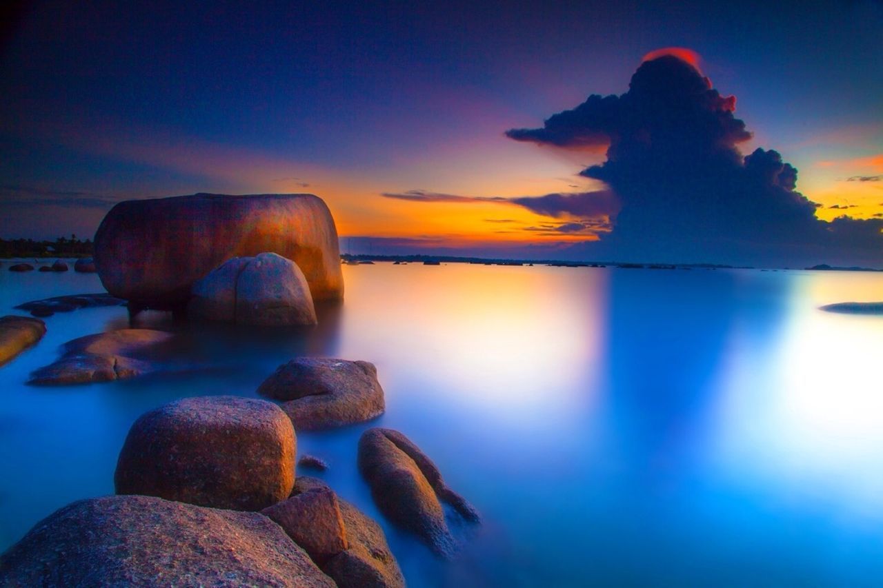 sunset, water, sky, sea, tranquility, beauty in nature, scenics, tranquil scene, rock - object, nature, blue, reflection, horizon over water, orange color, cloud - sky, idyllic, cloud, dusk, beach, stone - object