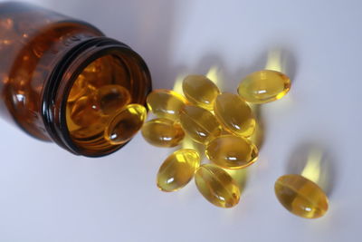 High angle view of bottles against white background