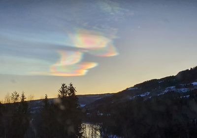 Scenic view of rainbow against sky during sunset