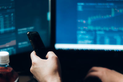 Close-up of man using mobile phone