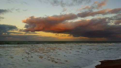 View of calm sea at sunset