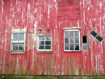 Low angle view of old red barn